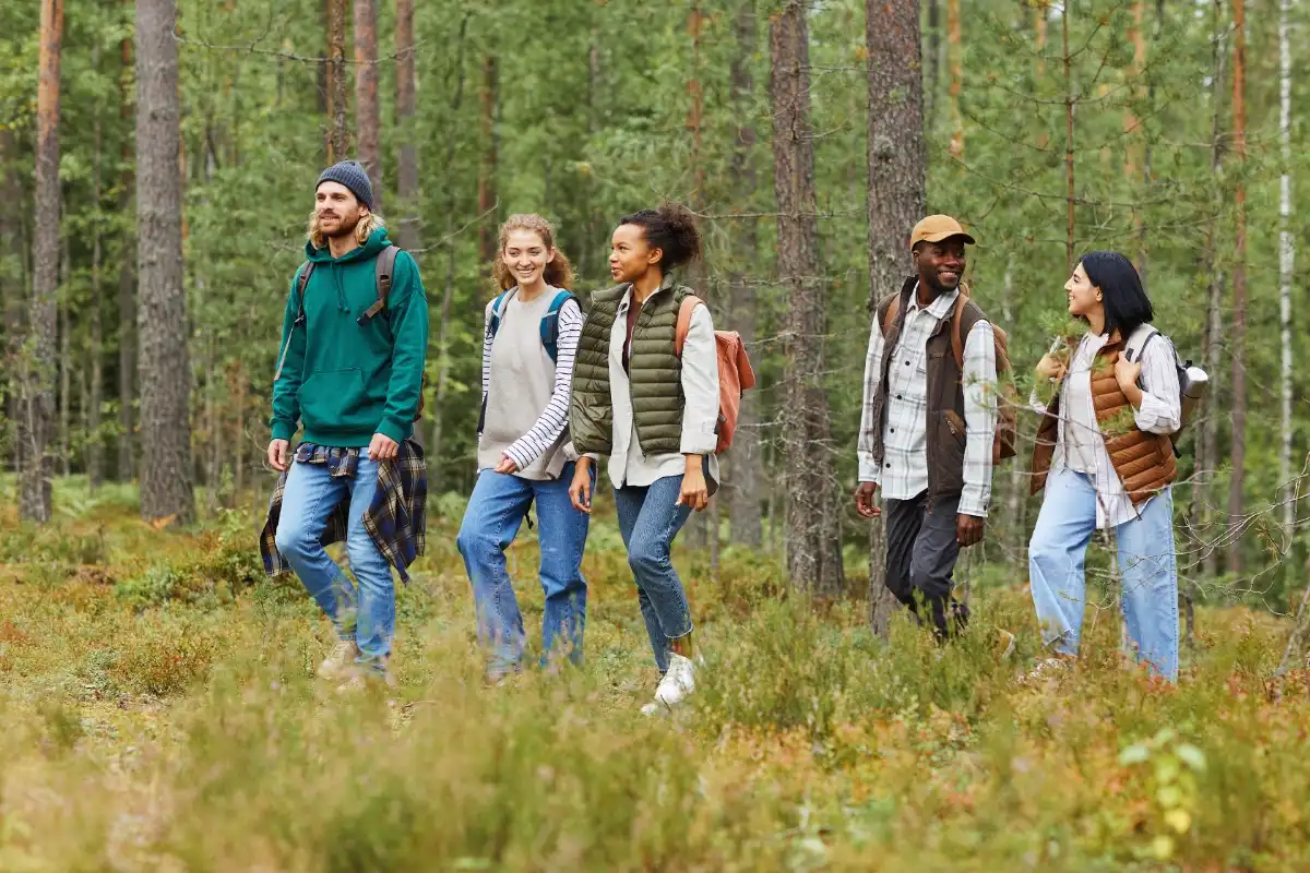 A group of friends walking in the forest - HappyMind Training Blog | Pouring From an Empty Cup