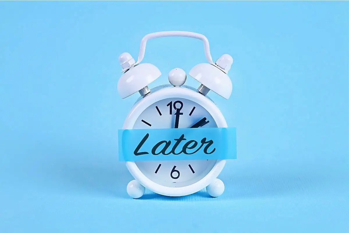 Happy Mind Training Blog | Procrastination - clock with later stuck on the front