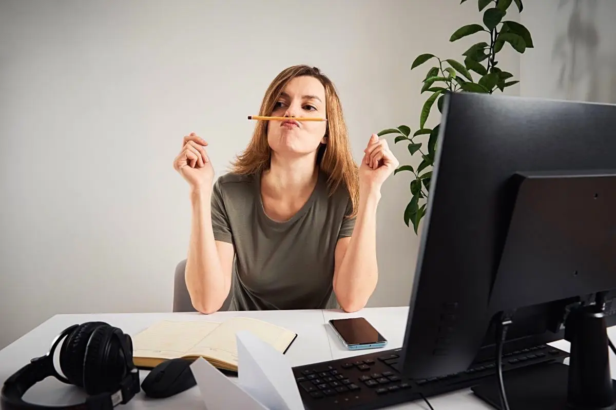 Happy Mind Training Blog | Procrastination - woman balancing a pencil on her nose
