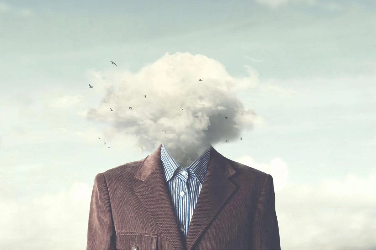 Illustration of a person with their head replaced by a cloud | HappyMind Training Blog | Recognising Stress