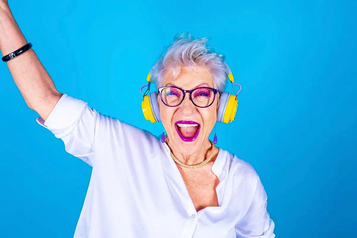 Person with headphones listening to music and dancing - Happy Mind Training Blog | 7 Ways Owning Your Mistakes Will Make You Powerful