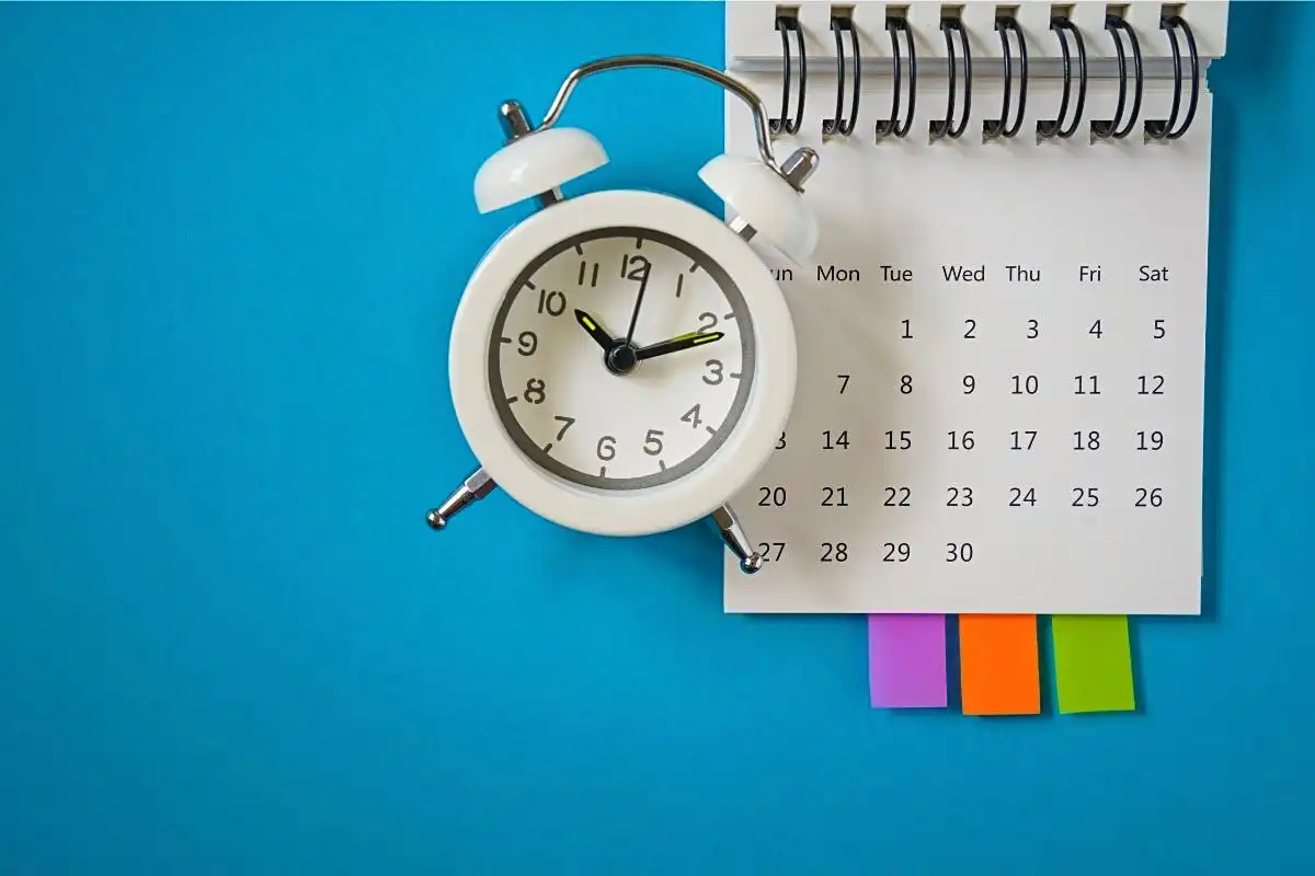 A calendar and an alarm clock - Happy Mind Training Blog | Why We All Need Routine